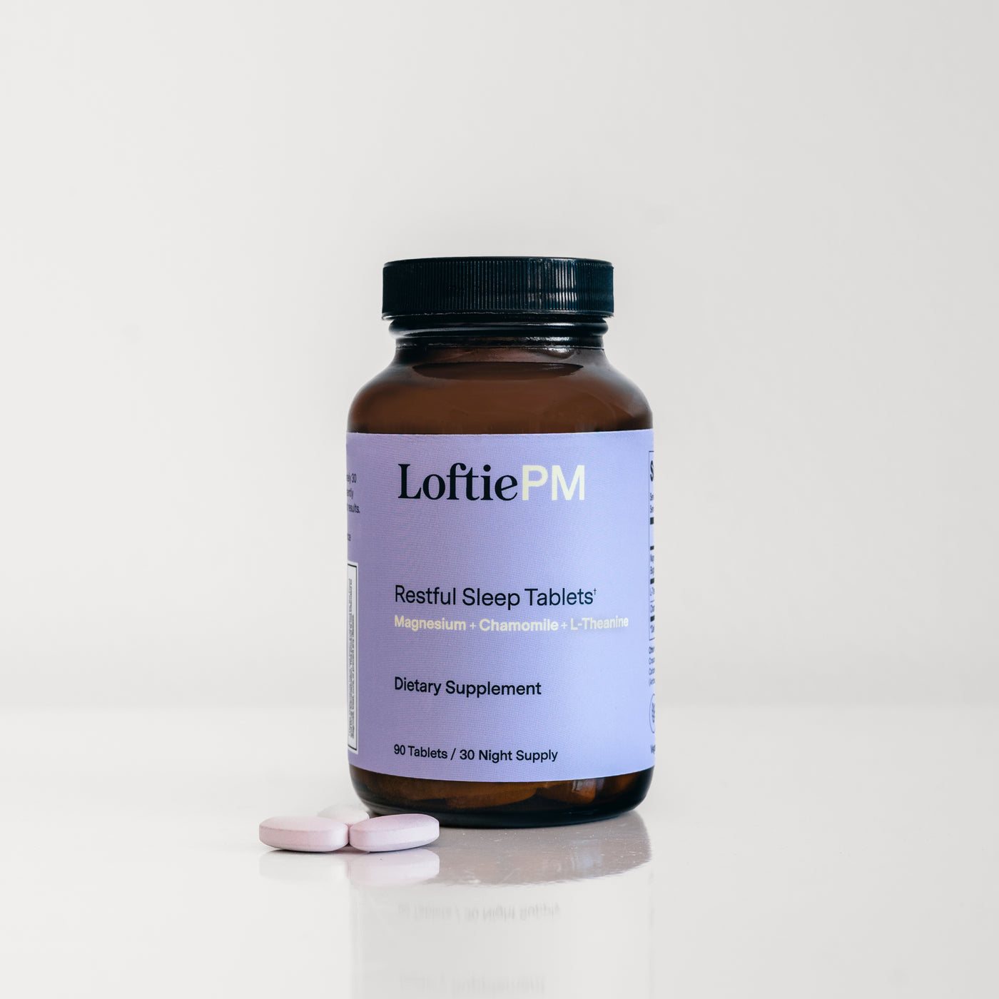 LoftiePM Restful Sleep Tablets supplement bottle with two pink tablets